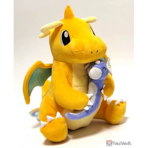 dragonite holding dratini plush